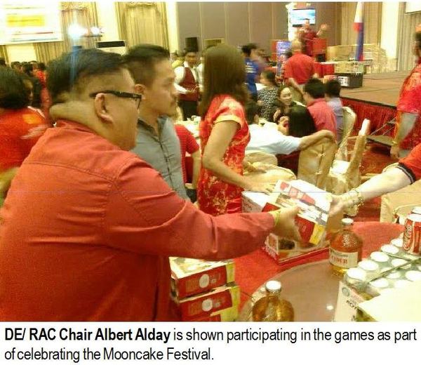 DE/RAC Chair Albert Alday is shown participating in the games as part of celebrating the Mooncake Festival.