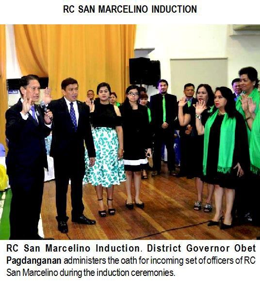 RC San Marcelino Induction. District Governor Obet Pagdanganan administers the oath for incoming set of officers of RC San Marcelino during the induction ceremonies.