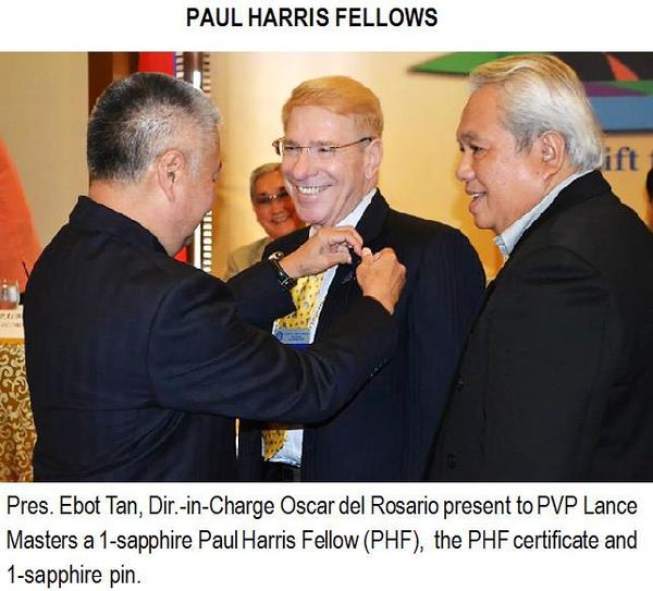 Pres. Ebot Tan, Dir.-in-Charge Oscar del Rosario present to PVP Lance Masters a 1-sapphire Paul Harris Fellow (PHF), the PHF certificate and 1-sapphire pin.