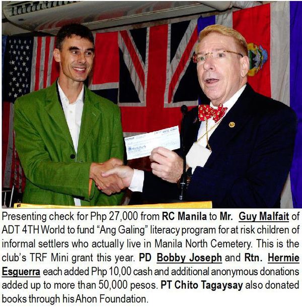 Presenting check for Php 27,000 from RC Manila to Mr. Guy Malfait of ADT 4TH World to fund "Ang Galing" literacy program for at risk children of informal settlers who actually live in Manila North Cemetery. This is the club's TRF Mini grant this year. PD Bobby Joseph and Rtn. Hermie Esguerra each added Php 10,00 cash and additional anonymous donations added up to more than 50,000 pesos. PT Chito Tagaysay also donated books through his Ahon Foundation.
