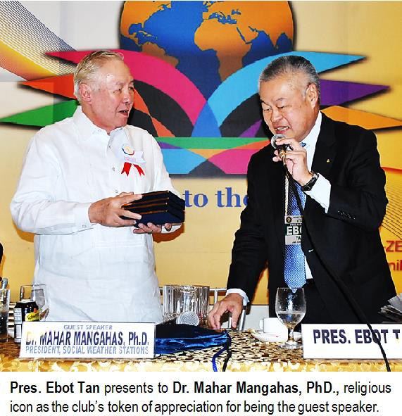 Pres. Ebot Tan presents to Dr. Mahar Mangahas, PhD., religious icon as the club's token of appreciation for being the guest speaker.