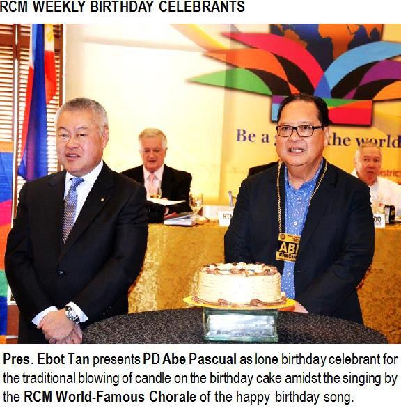 Pres. Ebot Tan presents PD Abe Pascual as lone birthday celebrant for the traditional blowing of candle on the birthday cake amidst the singing by the RCM World-Famous Chorale of the happy birthday song.