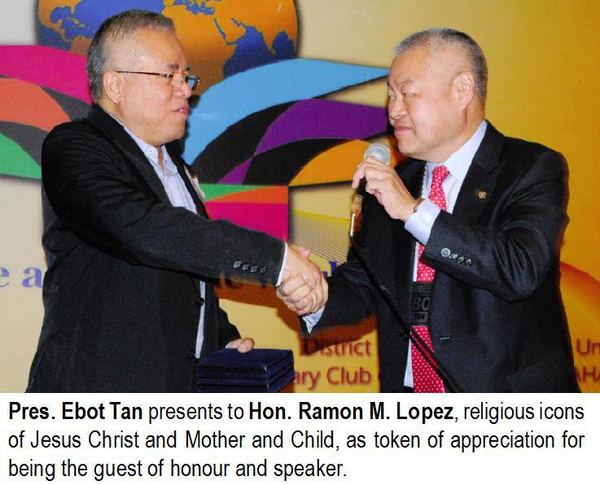 Pres. Ebot Tan presents to Hon. Ramon M. Lopez, religious icons of Jesus Christ and Mother and Child, as token of appreciation for being the guest of honour and speaker.