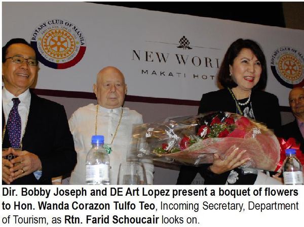 Dir. Bobby Joseph and DE Art Lopez present a bouquet of flowers to Hon. Wanda Corazon Tulfo Teo, Incoming Secretary, Department of Tourism, as Rtn. Farid Schoucair looks on.