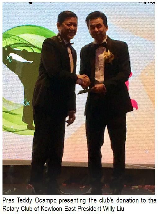 Pres Teddy Ocampo presenting the club's donation to the Rotary Club of Kowloon East President Willy Liu