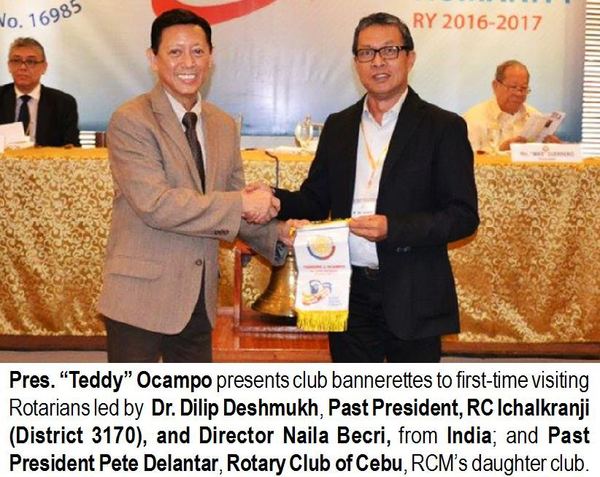 Pres. "Teddy" Ocampo presents club bannerettes to first-time visiting Rotarians led by Dr. Dilip Deshmukh, Past President, RC Ichalkranji (District 3170), and Director Naila Becri, from India; and Past President Pete Delantar, Rotary Club of Cebu, RCM's daughter club.