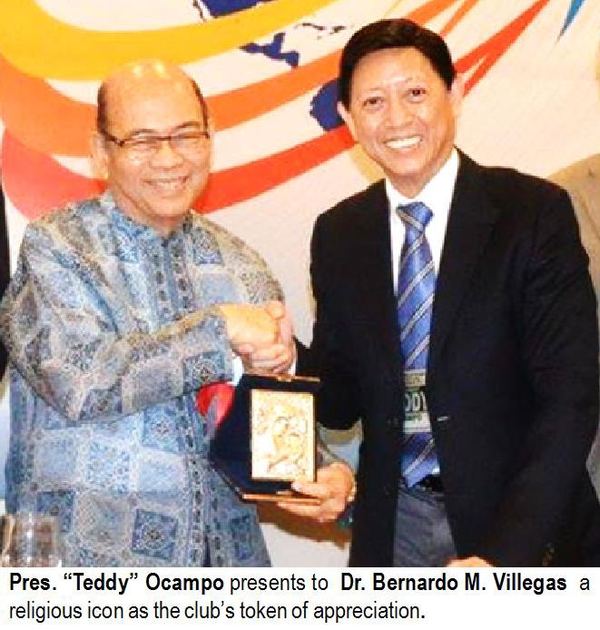 Pres. "Teddy" Ocampo presents to Dr. Bernardo M. Villegas a religious icon as the club's token of appreciation.