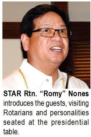 STAR Rtn. "Romy" Nones introduces the guests, visiting Rotarians and personalities seated at the presidential table.