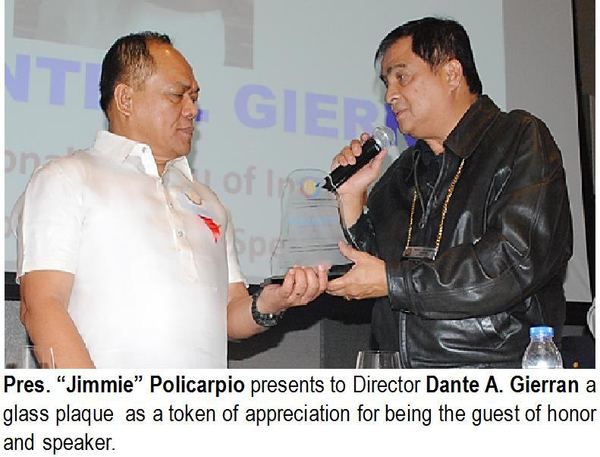 Pres. "Jimmie" Policarpio presents to Director Dante A. Gierran a glass plaque as a token of appreciation for being the guest of honor and speaker.