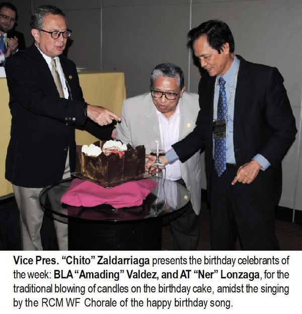 Vice Pres. “Chito” Zaldarriaga presents the birthday celebrants of the week: BLA “Amading” Valdez, and AT “Ner” Lonzaga, for the traditional blowing of candles on the birthday cake, amidst the singing by the RCM WF Chorale of the happy birthday song.