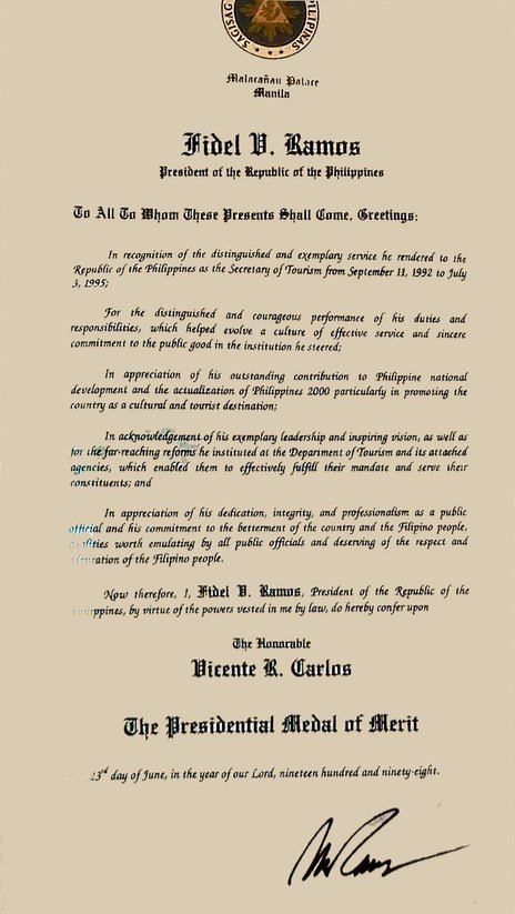 Vince Carlos receives the Presidential Award of Merit from President Fidel V. Ramos for exemplary contributions to public service and nation-building.