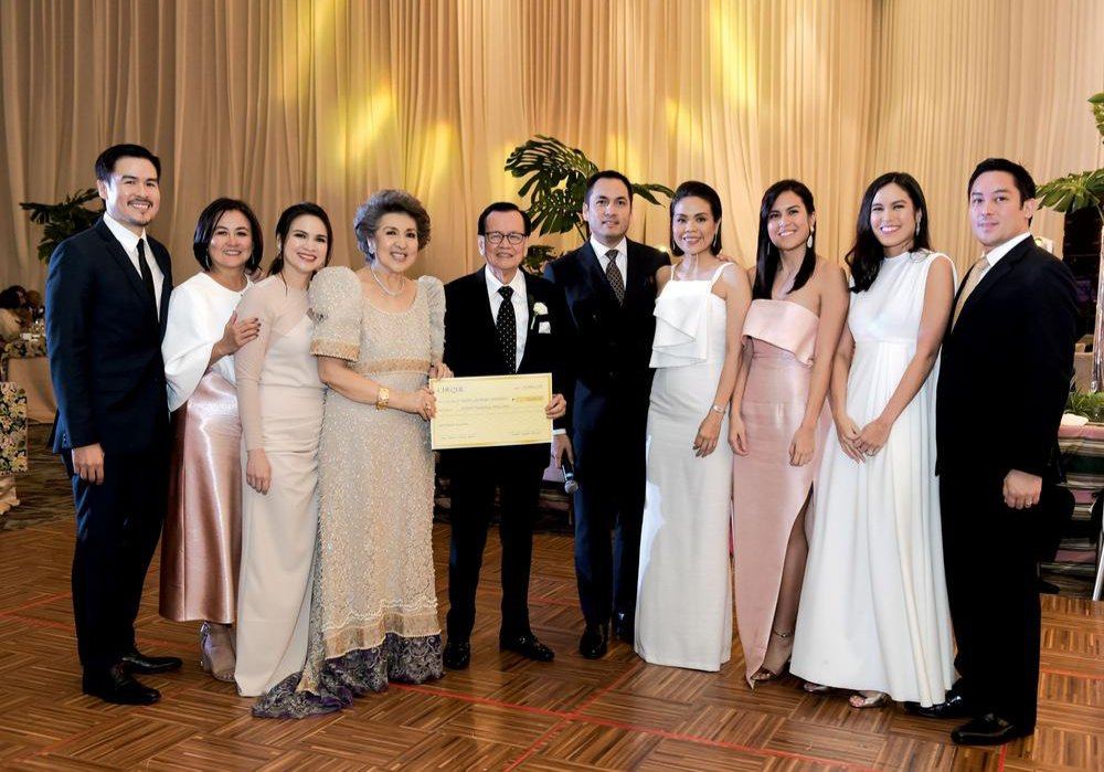 Surrounded by their children and loved ones, Susing and Maritess Pineda celebrate their golden wedding anniversary not only with gratitude and joy, but with a shared commitment to give back — proudly presenting a scholarship cheque that reflects fifty years of family, generosity, and purposeful living.