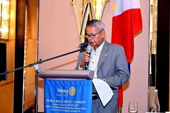 Past District Governor Alex Cureg introduces the Rotary Club of Manila's Guest of Honor and Speaker, Atty. Maria Rowena "Bing" Guanzon, for her address on democracy, elections, and public service. His introduction sets the stage for an engaging program and an important exchange of perspectives with Club members and guests.