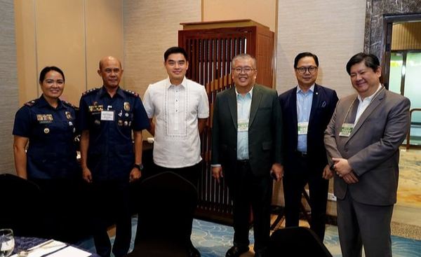 Philippine National Police representatives join Rotary Club of Manila officers for a photo during the policy dialogue. Among them are Police Colonel Florian Reynado, Club Secretary Albert Singson Alday, Director Michael Jaey Albaña, and Director Atty. Teddy Kalaw IV, united in a conversation about measuring police service by its impact on communities.