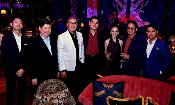 A pause for a photograph amid an evening worth celebrating, as our Rotary Club of Manila company gathers during "Timeless Duets". With smiles and wine glasses in hand, the group captures the relaxed spirit of a fellowship that brought familiar friends together in a refreshing new setting.