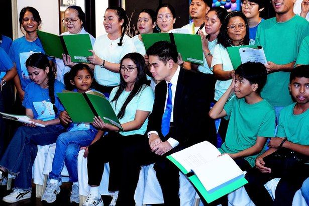 Sharing a song and a little sunshine. President Reginald Yu joining the children of Hospicio de San Jose in singing "You Are My Sunshine" at the opening of Beyond Limits.