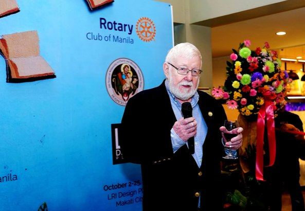 A toast to artistry and generosity. Rotarian Ray Davis, Chairman of the Hospicio de San Jose Committee, leads the ceremonial toast at the launch of Beyond Limits, celebrating the Angels of Rendu and the community supporting their creative journey.