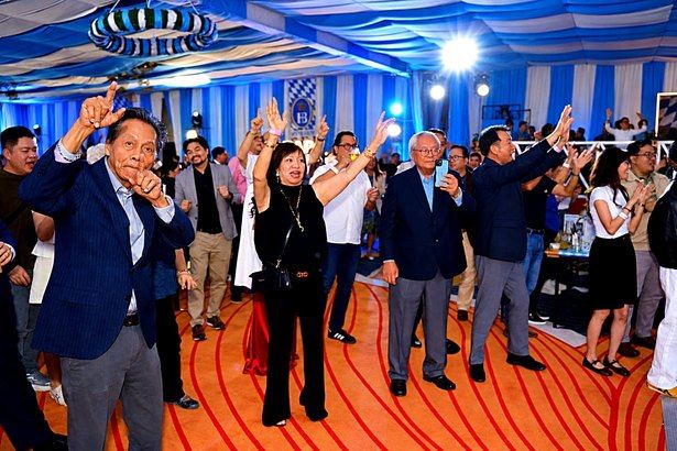 With hands raised and smiles brightening the ballroom, we surrendered happily to the music and the moment. Someone captured the merriment on a phone, while others simply danced, letting the evening carry them.