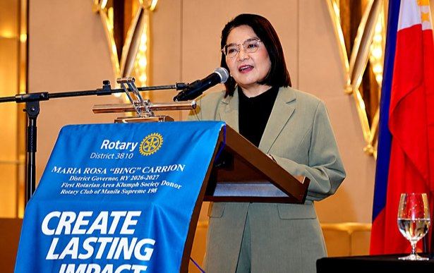 With the Philippine flag beside her, Atty. Claire addresses Rotary Manila on the responsibilities that accompany a public voice. She urges members to meet misinformation with evidence and to practice discernment before sharing what appears on their screens. Her appeal gives Rotary's Four-Way Test a place in everyday digital life, where a moment's pause can prevent a falsehood from traveling further.