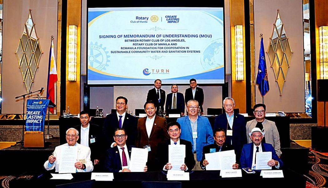 With signed documents held proudly, Rotary leaders mark a commitment to bring safe water closer to communities. At Fairmont Makati on October 15, 2026, the Rotary Club of Manila, Rotary Club of Los Angeles, and RCManila Foundation formalize their cooperation through a Memorandum of Understanding for sustainable community water and sanitation systems. As lead local club in the Philippine Water Warriors initiative, Rotary Manila will help coordinate community participation, project sites, and implementation. The ceremony opens a path toward demonstration water systems and possible expansion, carrying Rotary's promise of service from the signing table into the daily lives of families.