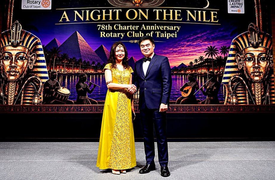 President Reggie Yu standing beside Maggie Huang, President of the Rotary Club of Taipei, carrying forward a friendship begun in 1982. "Our handshake at her club's 78th Charter Anniversary connected two presidents, two cities, and generations of Rotarians committed to service and understanding. Beneath the splendor of "A Night on the Nile."