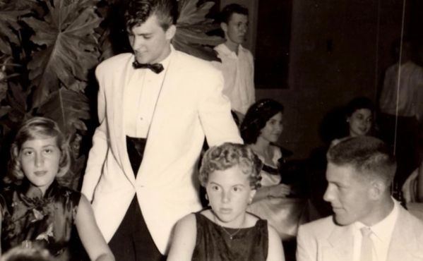 Seventeen. Before the titles, before the weight of office and institution, there was a young man in a white dinner jacket — poised between adolescence and destiny. The room is formal, the posture composed, but the future is still unwritten. At seventeen, Jackie had not yet learned the language of governance or stewardship. But the instinct was already there: attentiveness, restraint, a quiet awareness of responsibility beyond himself. 

Fire had not yet tested him. Oxygen had not yet become metaphor. He was simply a young man stepping into the world — unaware that one day he would help steady the air within it.