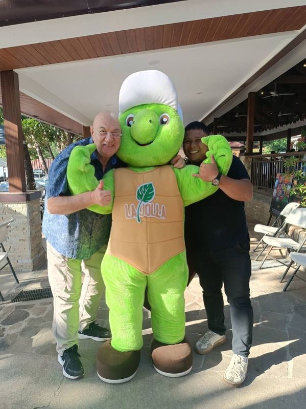 Bollie shares a fun and spirited moment with La Jolla’s cheerful mascot, Pawi — short for "pawikan" (sea turtle) — capturing the playful side of hospitality. With smiles, thumbs up, and a sense of lighthearted energy, the scene reflects the welcoming atmosphere and family-friendly charm that La Jolla embodies — where every guest experience is meant to be warm, memorable, and full of joy